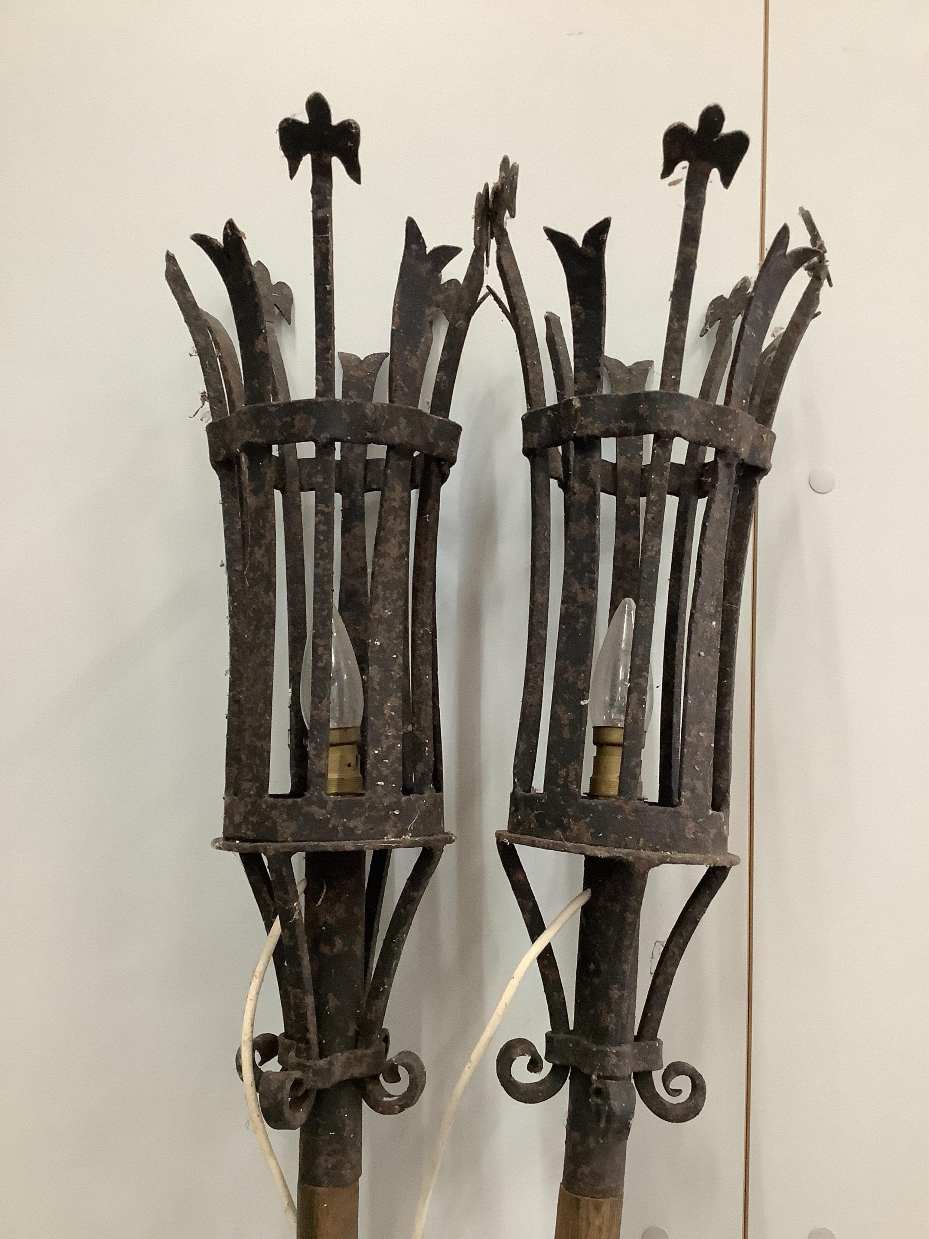 A pair of gondola style wrought iron and oak lanterns, height 190cm. Condition - fair to good